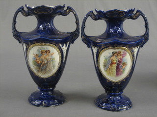 A pair of Edwardian blue glazed pottery twin handled vases with panel decoration 12"