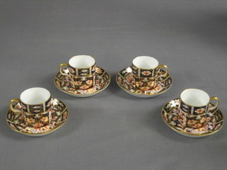A set of 8 Royal Crown Derby coffee cans and saucers and 2 matching coffee cans