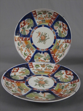 A pair of 19th Century Japanese Imari porcelain chargers with panel bodies 14 1/2"