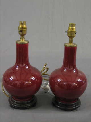 A pair of club shaped Ox blood table lamps 11"