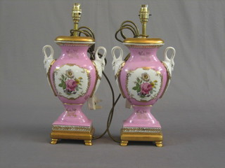 A pair of reproduction French twin handled table lamps with puce bodies, gilt borders and floral decoration 16"