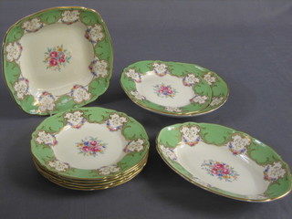 A 9 piece Royal Worcester dessert service comprising oval twin handled bowl 10", a circular bowl 9 1/2", a square bowl 9" and 6 plates 8 1/2", having floral decoration to the centre within green and gilt borders, the reverse with purple Royal Worcester mark 1481 and impressed 15 N8