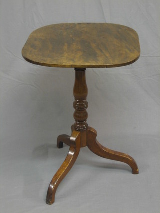 A 19th Century oval snap top wine table, raised on pillar and tripod supports 21"