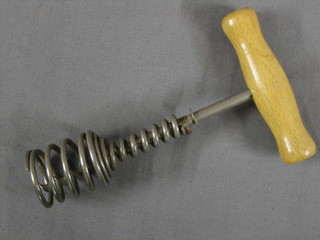 A 20th Century Continental steel corkscrew with spring and polished beech handle 6"