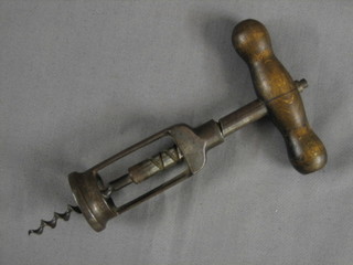 A steel corkscrew with turned wooden handle 7" overall