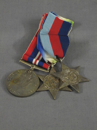 A group of 3 medals comprising a silvered 39/45 Star, a silvered Atlantic Star and a British War medal