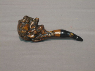 An Oriental carved cheroot holder in the form of a claw 4"