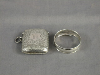 An engraved silver vesta case, Birmingham 1900 and a silver napkin ring