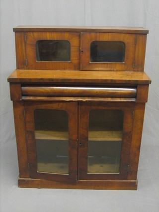 A Victorian mahogany chiffonier with raised super structure to the back enclosed by a pair of arch shaped panelled doors, the base fitted a cupboard with shelf enclosed by arch panelled doors, raised on a platform base 36"