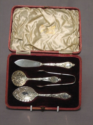 A Victorian cased silver afternoon tea accoutrement set comprising butter knife, jam spoon, sugar tongs and sifter spoon, Birmingham 1897, 2 ozs