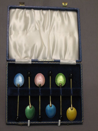 A set of 6 Art Deco gilt metal and enamel coffee spoons, cased