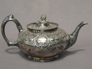 A Victorian embossed and engraved Britannia metal teapot