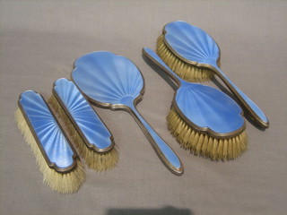 An Art Deco silver and blue enamelled 5 piece dressing table set comprising pair of hair brushes, pair of clothes brushes and hand mirror Birmingham 1932