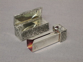 An Art Deco engraved white metal lipstick case, the lid incorporating a mirror (f)