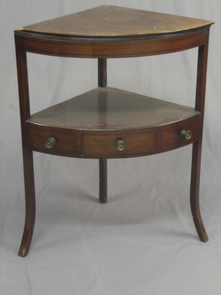 A Georgian mahogany corner wash stand, fitted a bowl receptical and 2 other recepticals, having and undertier, the base fitted a drawer, raised on splayed supports 26"