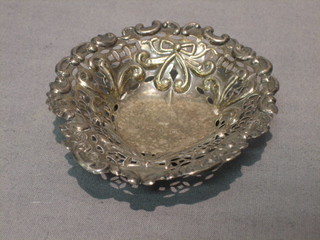 A pierced Edwardian "silver" heart shaped dish raised on 3 feet 4"