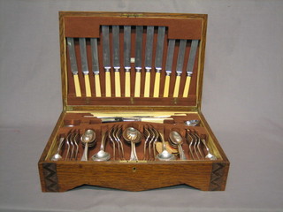 A canteen of silver plated Old English pattern flatware contained in an oak canteen box