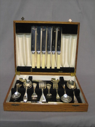 A part canteen of Old English silver plated flatware contained in an oak canteen box