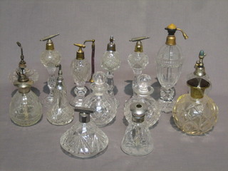 A collection of 14 various cut glass scent bottles with silver lids