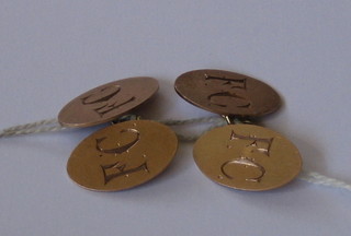 A pair of oval 9ct gold cufflinks with engraved decoration