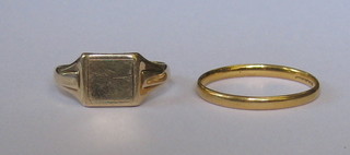 A 22ct gold wedding band and a 9ct gold signet ring