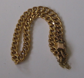 A modern 9ct gold curb link bracelet