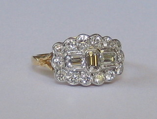 A lady's 18ct yellow gold dress ring set 3 baguette diamonds surrounded by 14 diamonds (approx 1.20ct)