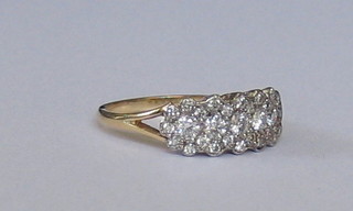 A lady's 18ct yellow gold  triple cluster diamond dress ring set numerous diamonds (0.70ct)