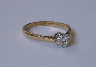 A lady's 18ct gold engagement ring set a solitaire diamond (appx 0.75ct)