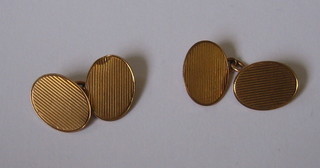 A pair of oval 9ct gold cufflinks