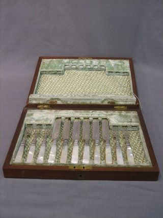 A set of 6 fruit knives and 5 forks contained in a walnut canteen box (lid f)