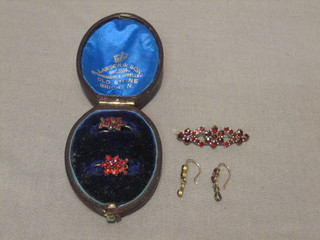 2 pairs of Victorian red stone earrings and a matching brooch