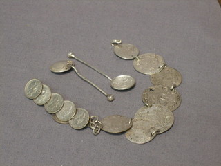 A brooch formed from hammered Eastern silver coins, a bracelet and 2 condiment spoons formed from coins