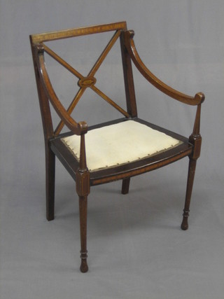 An Edwardian Georgian style inlaid mahogany open arm chair with X frame back and upholstered seat, raised on turned supports