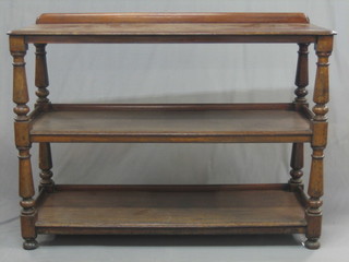 A Victorian mahogany 3 tier buffet, raised on turned supports 54"
