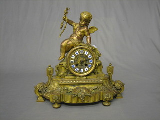 A 19th Century French 8 day striking mantel clock contained in a gilt spelter case surmounted by a figure of a winged cherub