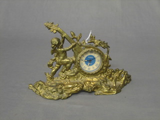 A 1950's Slava mantel clock contained in a gilt metal case in the form of a cherub supporting a mandolin 10"