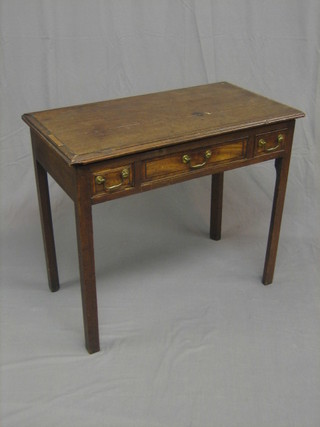A Georgian mahogany rectangular side table, fitted 1 long drawer, flanked by a pair of 2 short drawers and raised on square supports with crossbanded top (crack to top) 33"