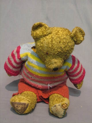 An old yellow teddybear with articulated limbs 23"