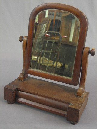 A 19th Century Victorian arched plate dressing table mirror contained in a mahogany frame the base fitted a drawer