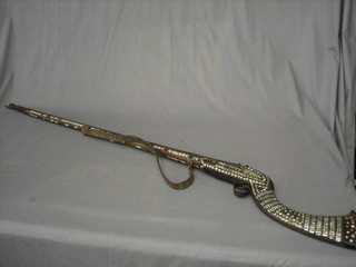 An 18th/19th Century long armed native flintlock jazail with 46" barrel, inlaid mother of pearl stock and complete with ram rod