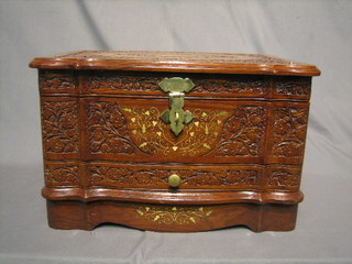 A 20th Century Eastern heavily carved and inlaid brass trinket box with hinged lid, the base fitted a drawer 19"