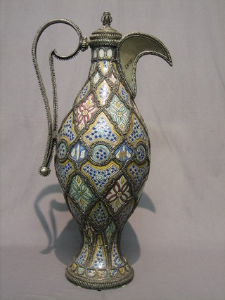 A large and impressive 20th Century Ismic style pottery and metal clad ewer 29"
