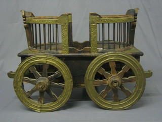 A 20th Century Eastern model of a 4 wheeled cart 20"