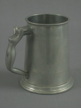 A pewter tankard, the handle in the form of a naked lady