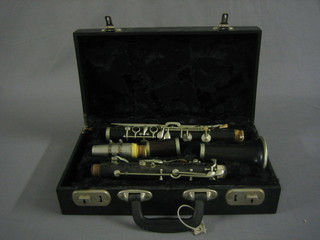A French wooden clarinet by Dore of Paris, contained in a plastic case