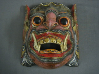 An Eastern painted and carved wooden mask 9"