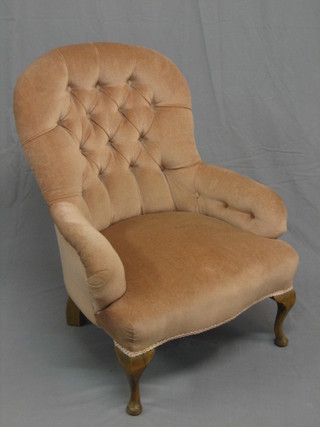 A Victorian style beech framed tub back chair upholstered in pink material, raised on cabriole supports
