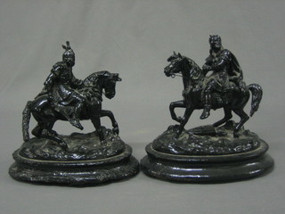 A pair of black painted spelter figures of horseman 9"