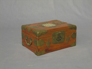 An Eastern hardwood jewellery box with embossed metal mounts and hinged lid 8"